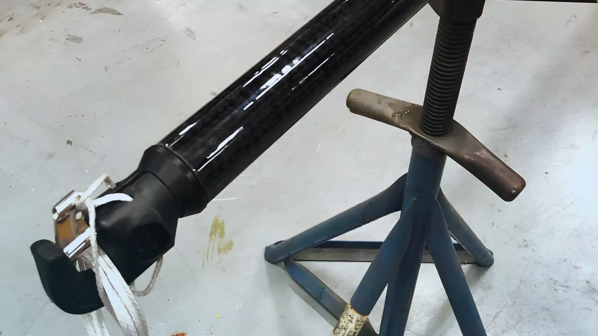 carbon fiber spinnaker pole mounted on sailboat